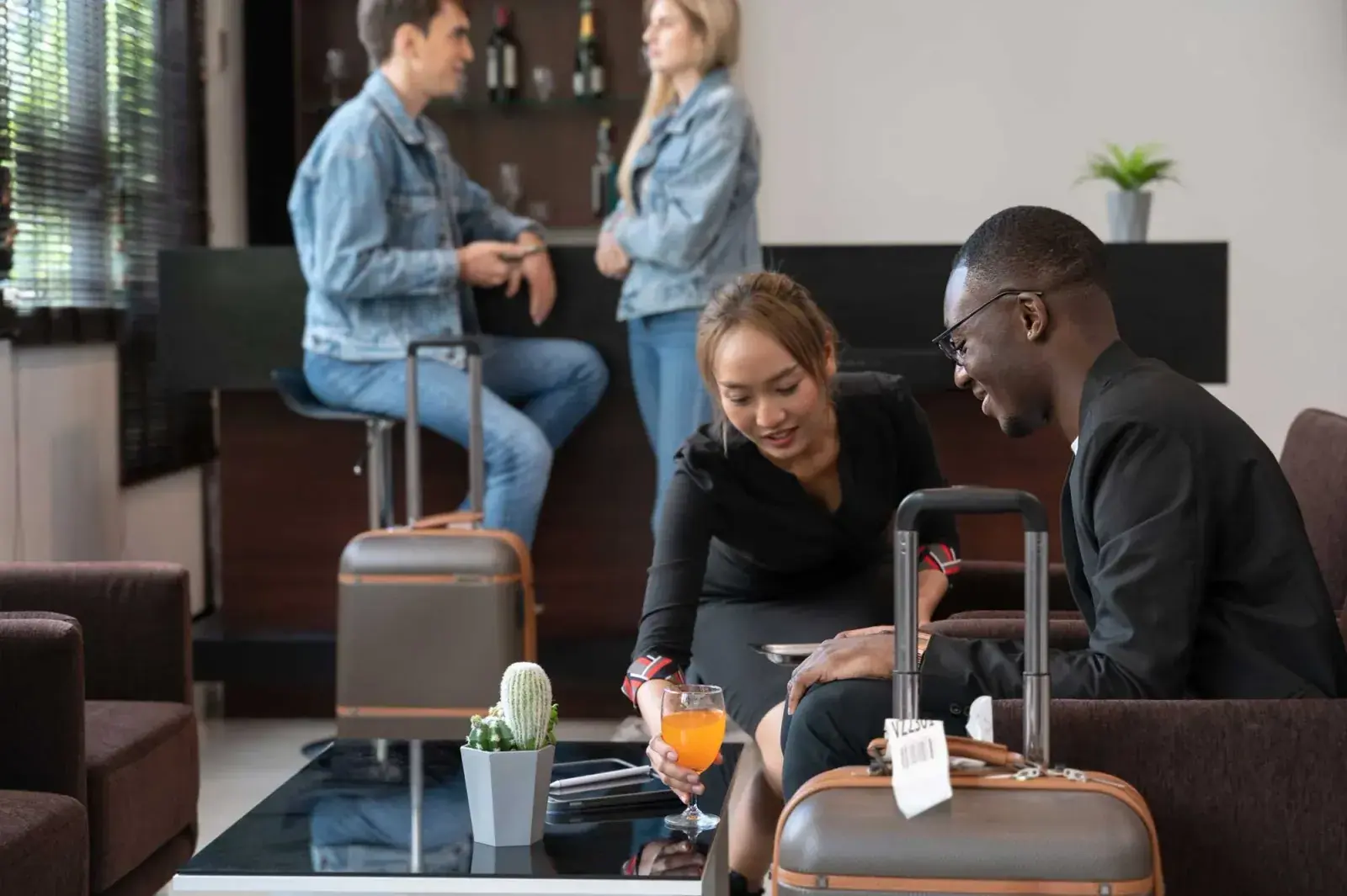 A couple passes time in an airport lounge